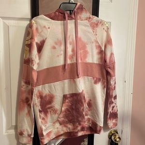 Pink and white tie dye hoodie with gold writing